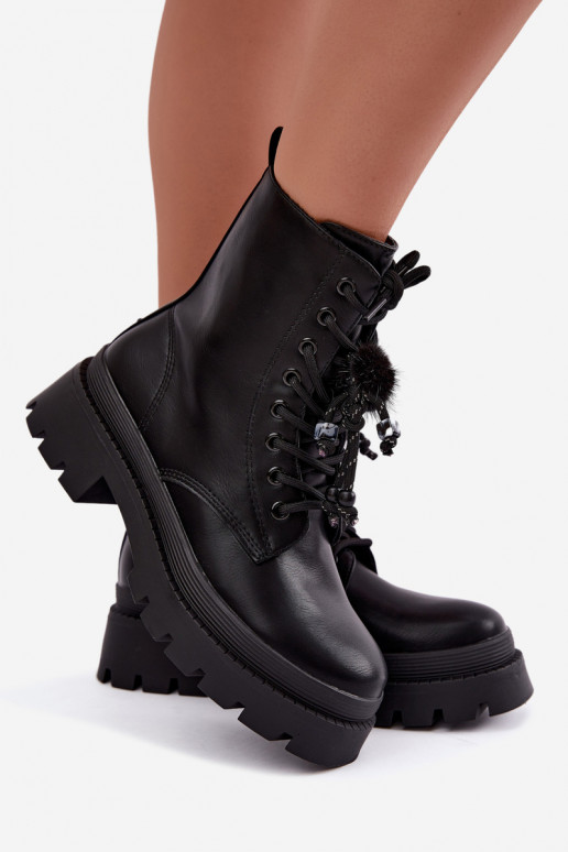 botas aisladas con pompones esponjosos en negro Faresse