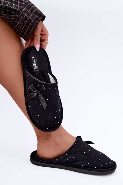 Zapatillas decoradas con lazos negros Loriane