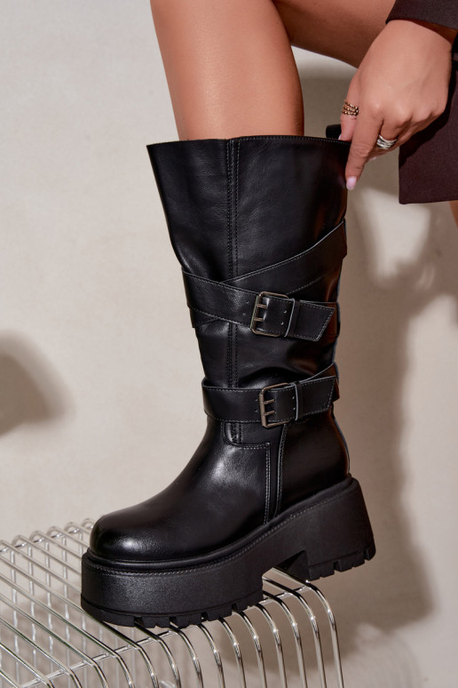 Botas altas con plataforma y correas en negro Delsenne