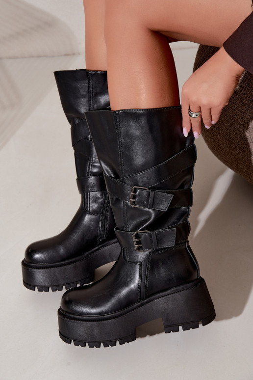 Botas altas con plataforma y correas en negro Delsenne
