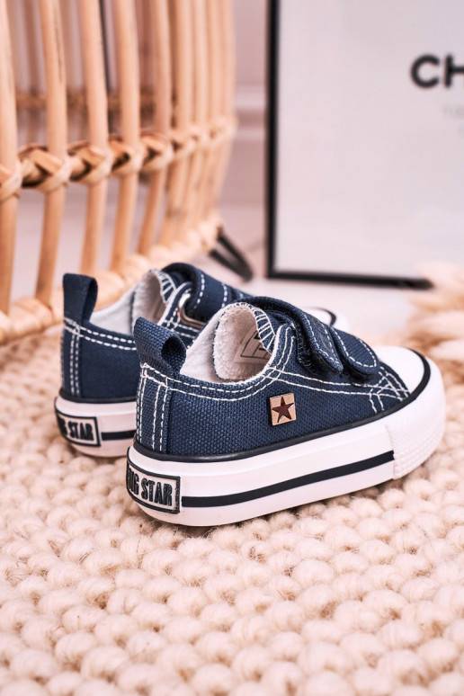 Zapatos de ocio para niños con cierres adhesivos en color azul oscuro.