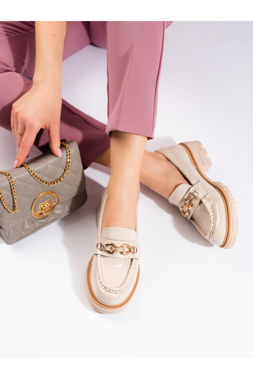 Botines color arena con detalles...