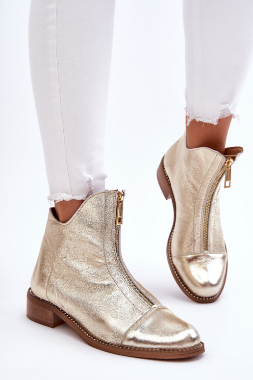 Botas con cremalleras en color dorado...
