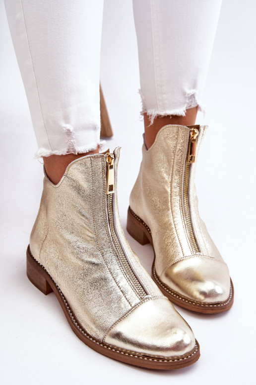 Botas con cremalleras en color dorado...