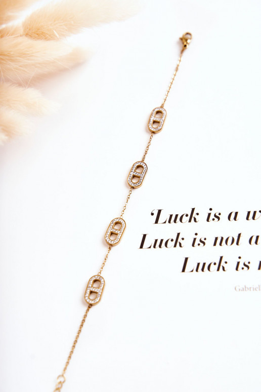 Pulsera de mujer con ojos brillantes en color dorado.