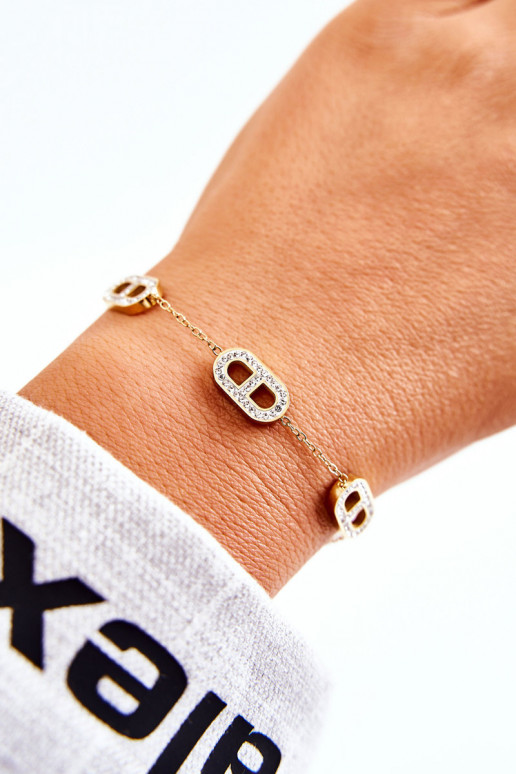 Pulsera de mujer con ojos brillantes en color dorado.