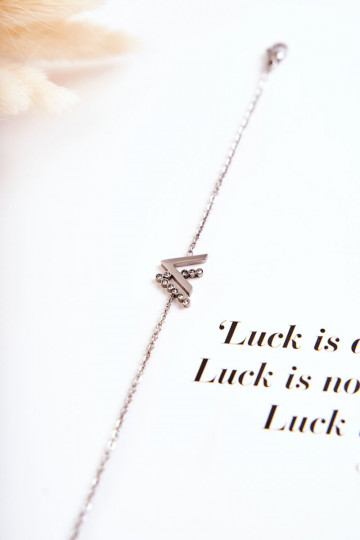 Pulsera con cadena con ojos brillantes, color plateado.