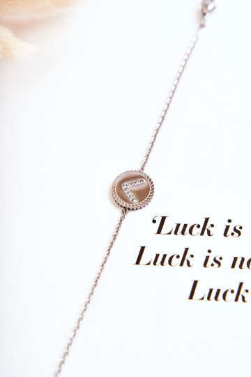 Pulsera de mujer con adornos y ojos de circonitas, color plata.