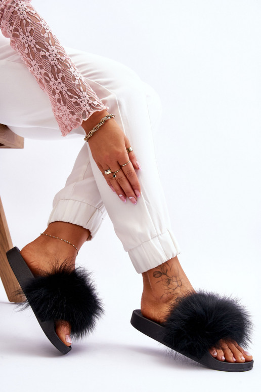 Zapatillas de goma con estilo con un abrigo de piel de color negro Lucrece Zapatillas de goma con estilo con un abrigo de piel de color negro Lucrece