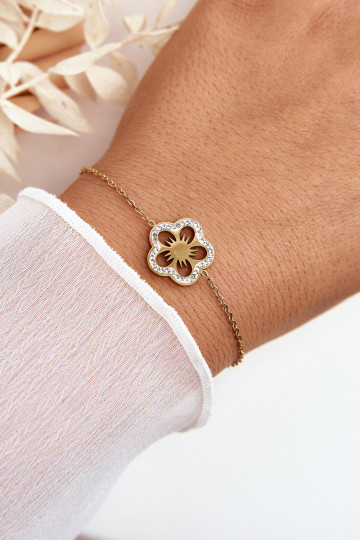 Pulsera con flores en color dorado.