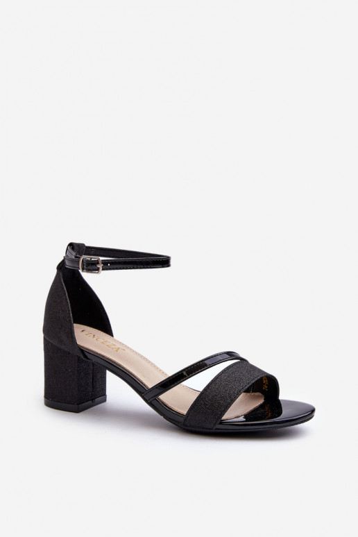 Sandalias brillantes con tacón bajo en color negro Ploemis
