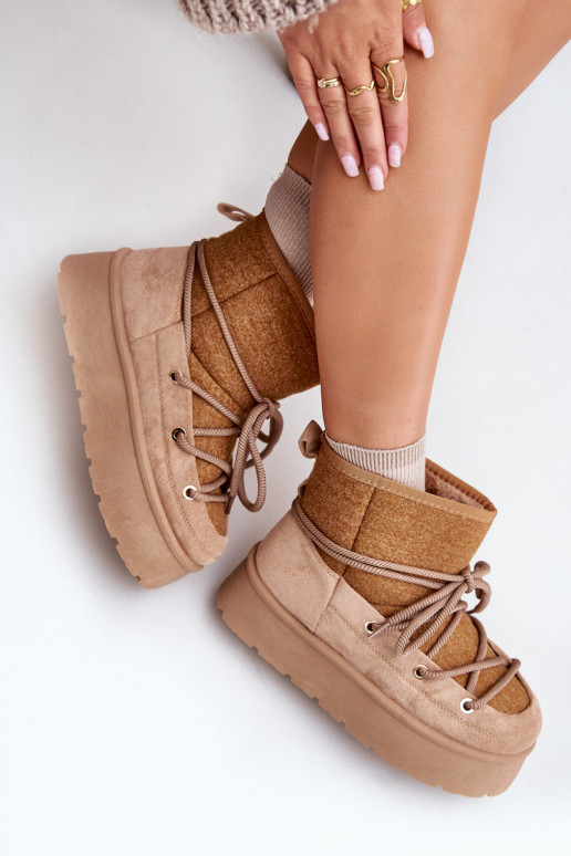 Botas de nieve con detalles elegantes con una plataforma color marrón Tiene quevora Botas de nieve con detalles elegantes con una plataforma color marrón Tiene quevora