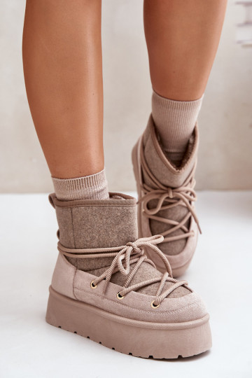 Botas de nieve con elegantes detalles con plataforma en color beige 2