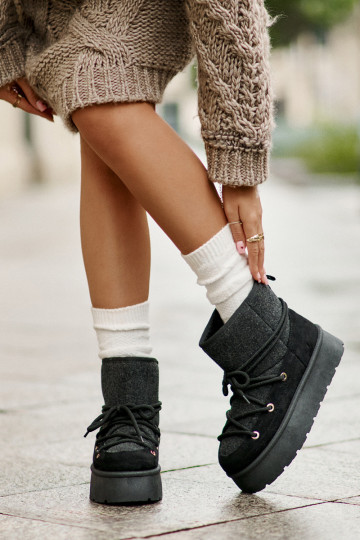 Botas de nieve con detalles elegantes con una plataforma de color negro Tiene quevora