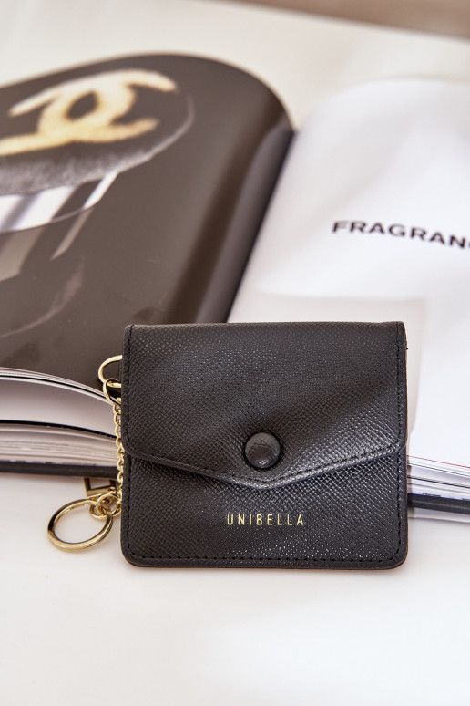 Estuche con tarjeta de color dorado con llavero de eco piel color negro Iritinme