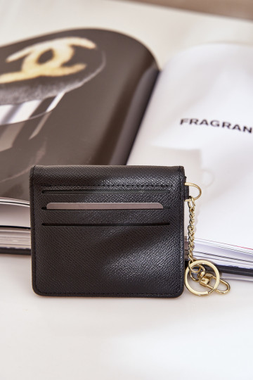Estuche con tarjeta de color dorado con llavero de eco piel color negro Iritinme 2