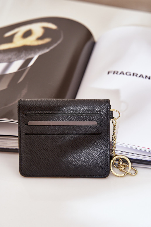 Estuche con tarjeta de color dorado con llavero de eco piel color negro Iritinme